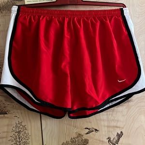 Red Nike running shorts